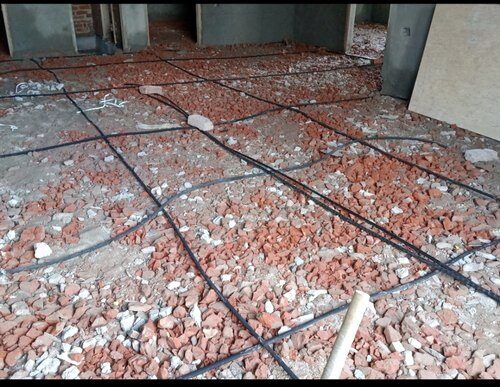 Porous pipe termite barrier system installed during foundation construction for permanent termite protection in Jalandhar